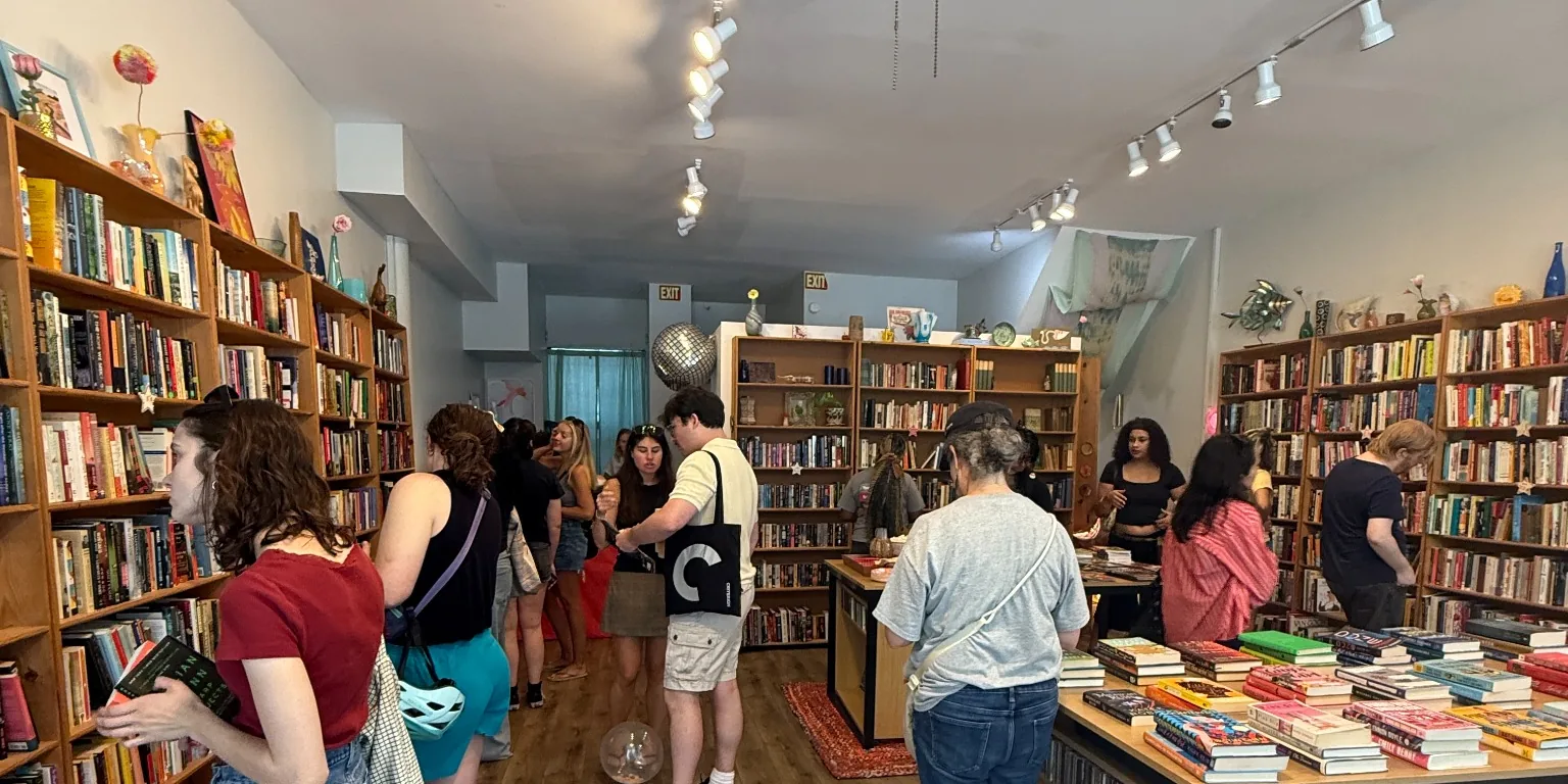 A busy afternoon inside the Books4Cause free bookstore, with visitors browsing the shelves